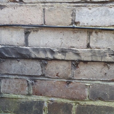 Slate damp proof courses are usually hidden behind the wide mortar joint
